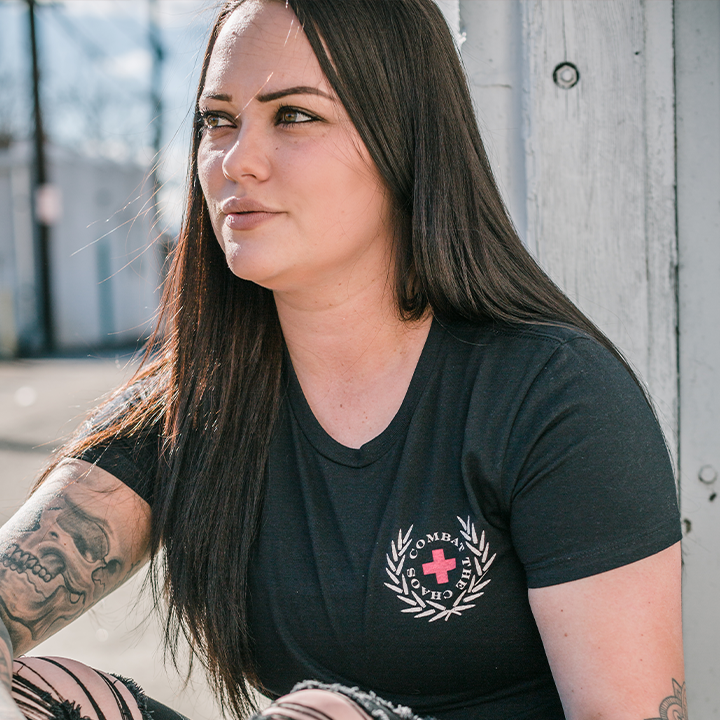 Woman wearing a black CTC short sleeved shirt